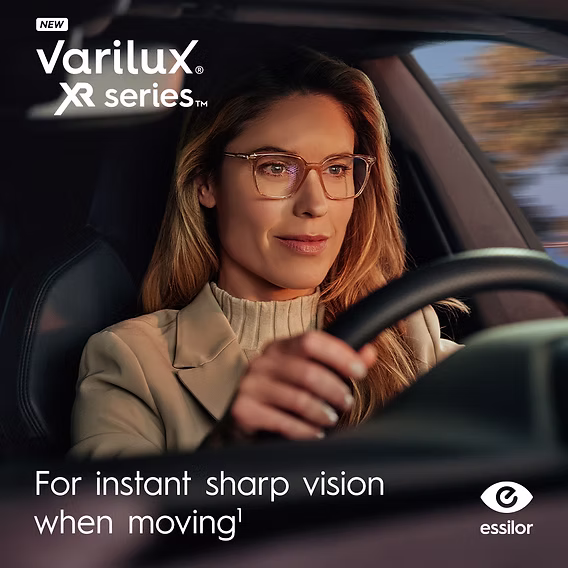 Woman driving while wearing Varilux XR series varifocal lenses